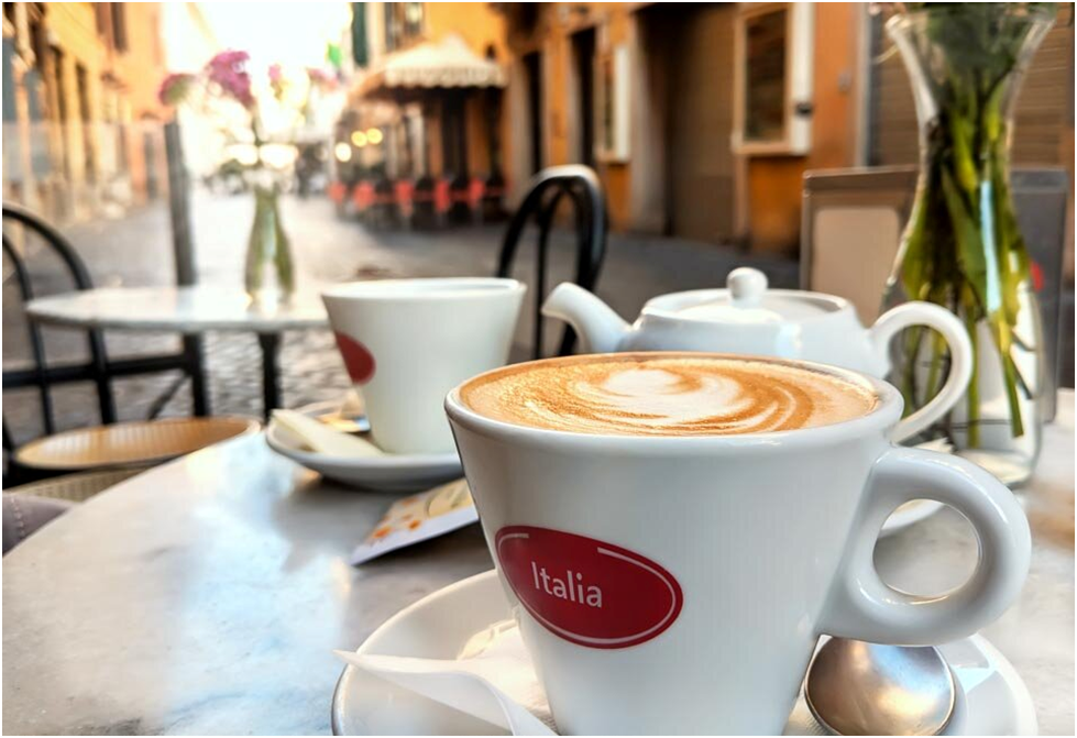 Italian espresso with a generous dollop of frothy steamed milk and may be accompanied by a sprinkle of chocolate