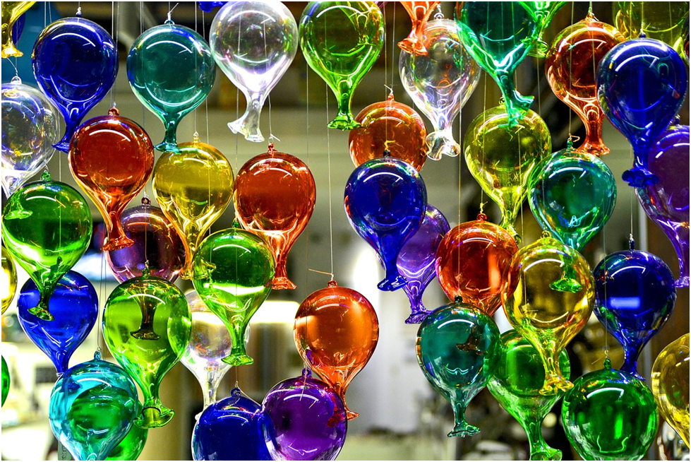 Glass decorations hang in a shop in Murano, Italy