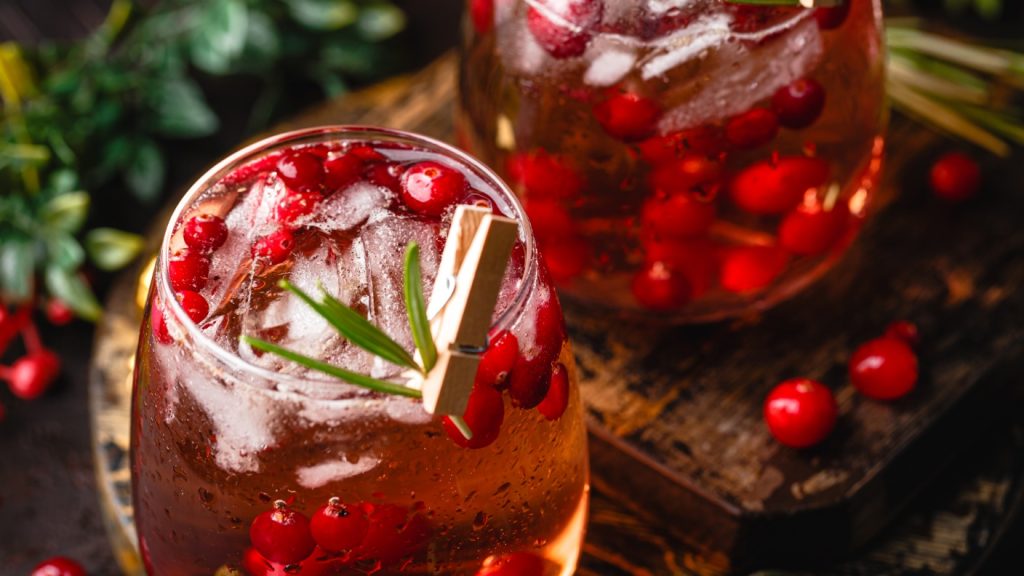 Red drinks with cranberries and springs of thyme
