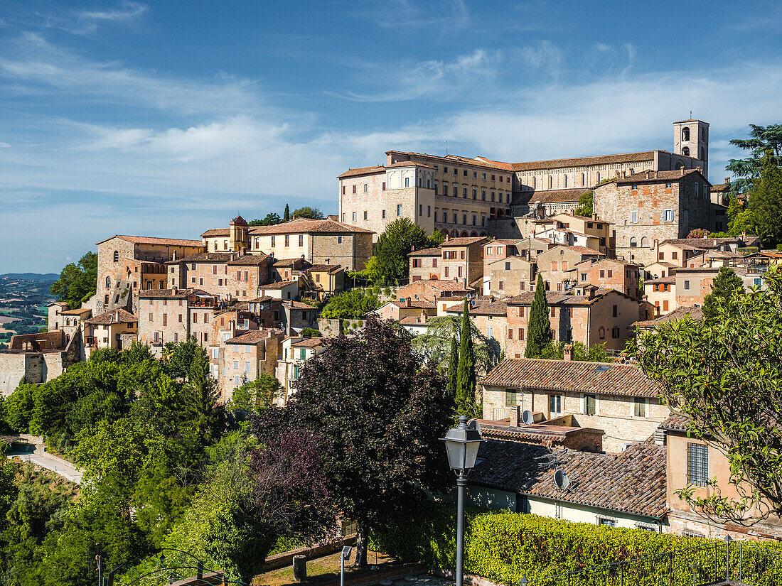 A hillside covered with buildings in Todi.